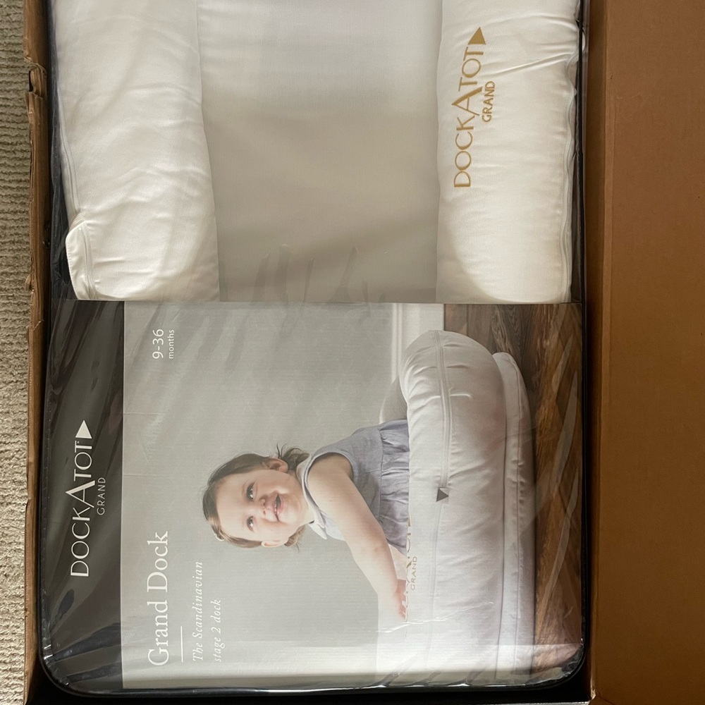 Dock a tot brand new, never used, still all packed up dockAtot grand 9-36 months